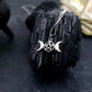 A styled image of the triple goddess pentagram necklace from Uncorked & Bottled Up